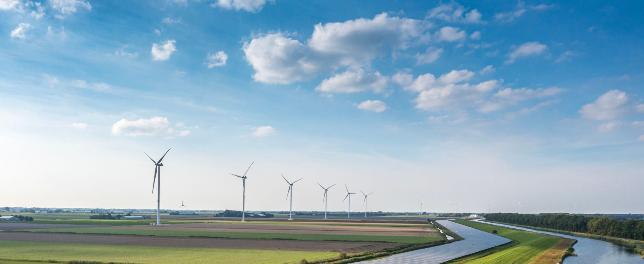 Solar panels and wind turbines generating renewable energy